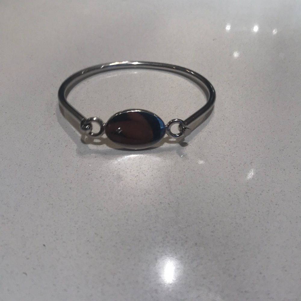 Silver bangle with diamond accent